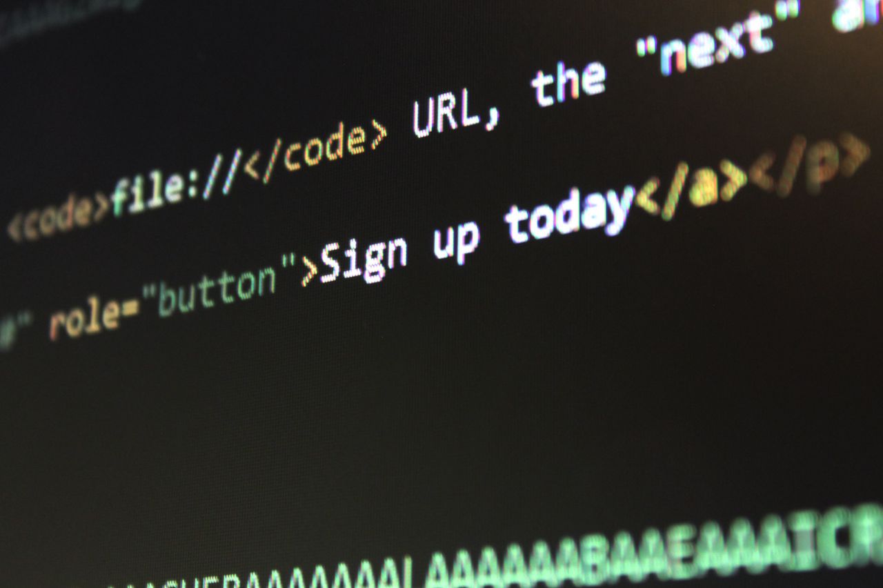 Services Detailed view of HTML and CSS code on a computer screen, concept of programming.